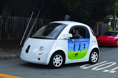 Google self-driving car with a human passenger