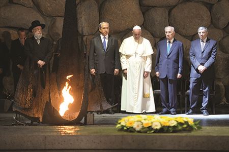 Pope Francis praying at the Hall of Remembrance at the Yad Vashem Holocaust Memorial